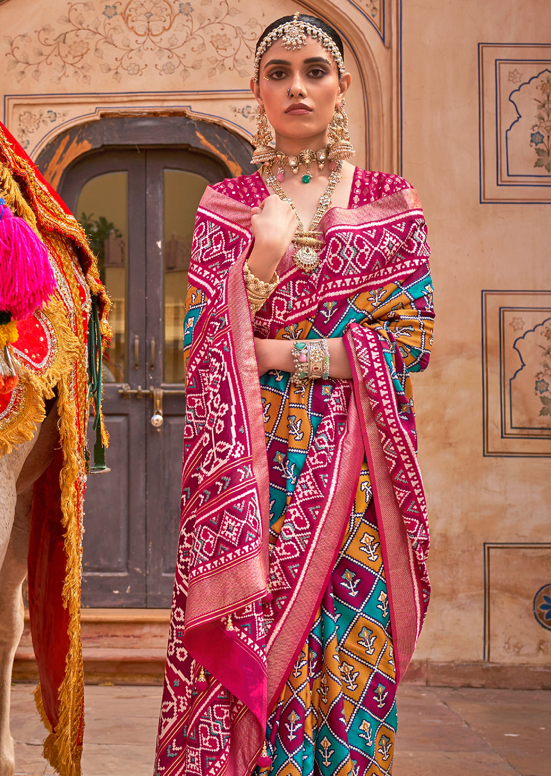 Pink	Woven Patola Silk Saree