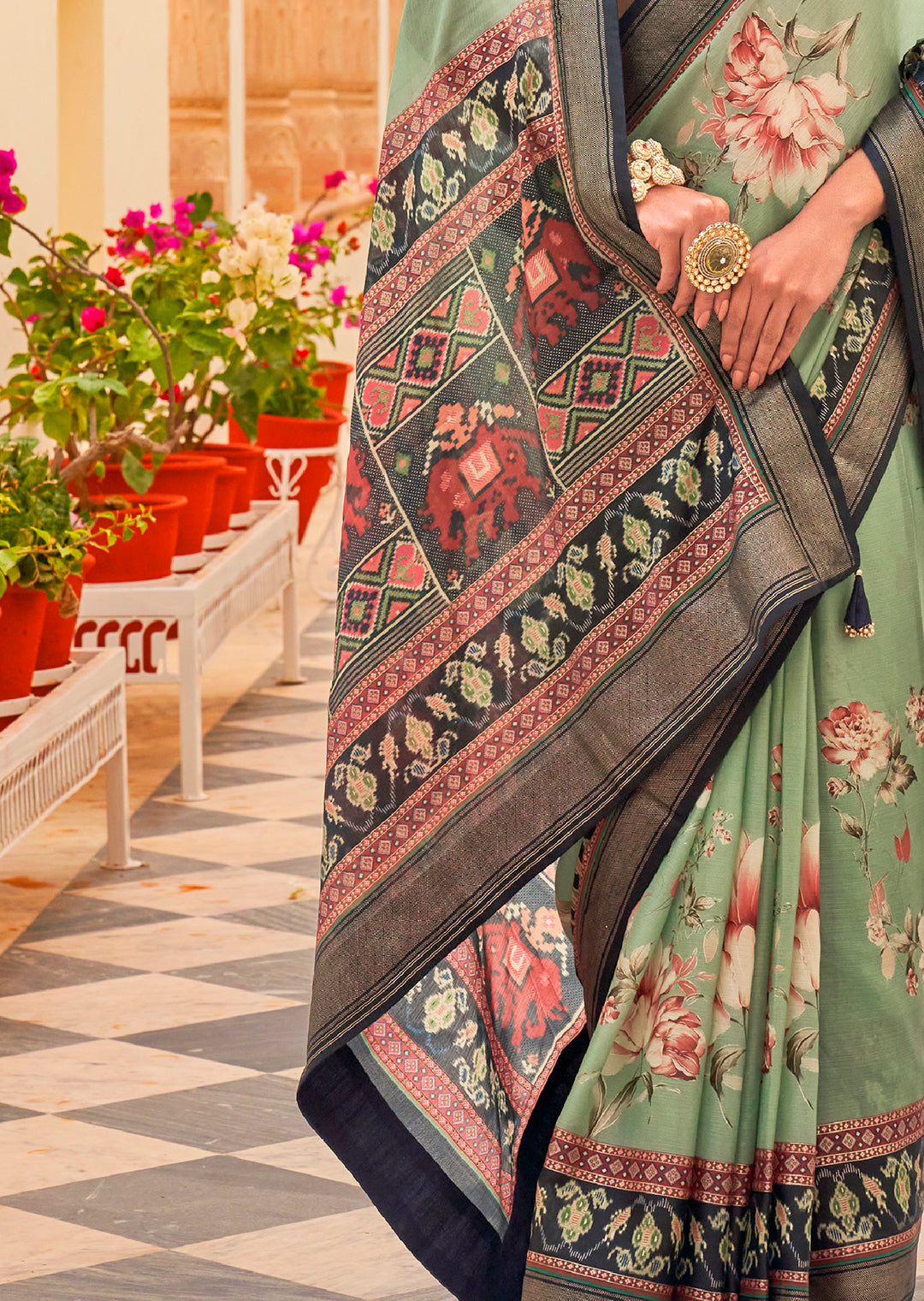 Pistachio Green Woven Chiffon Patola Saree