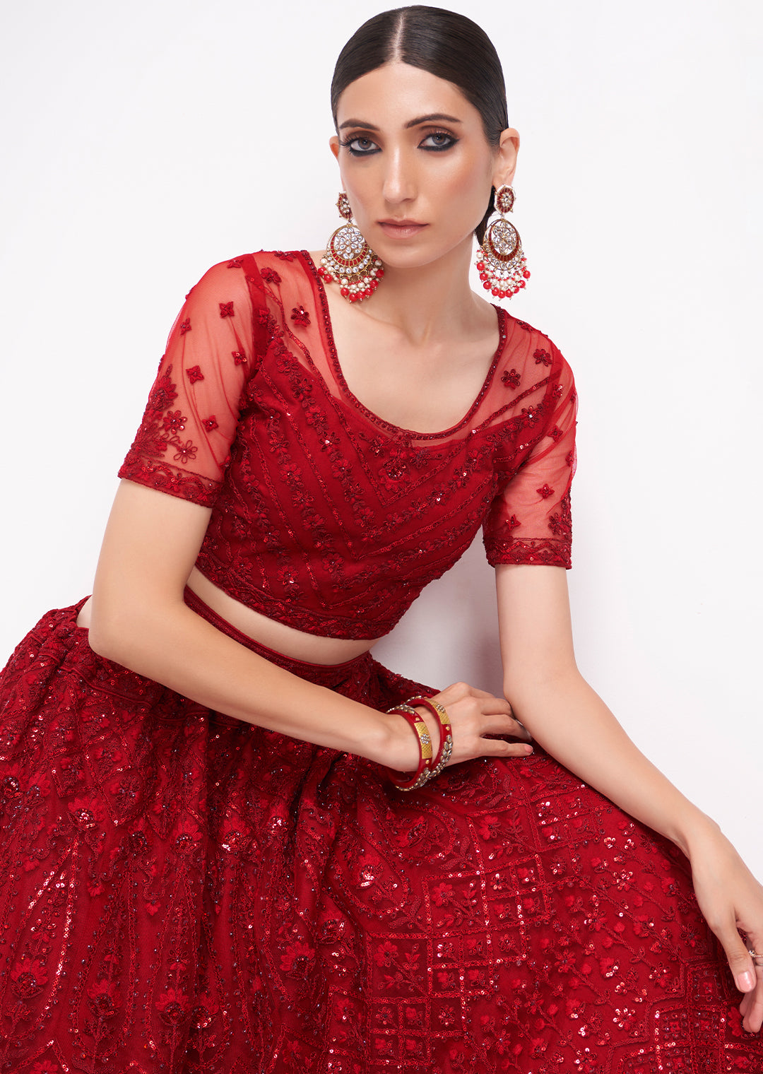 RED HEAVY EMBROIDERED PREMIUM NET DESIGNER LEHENGA