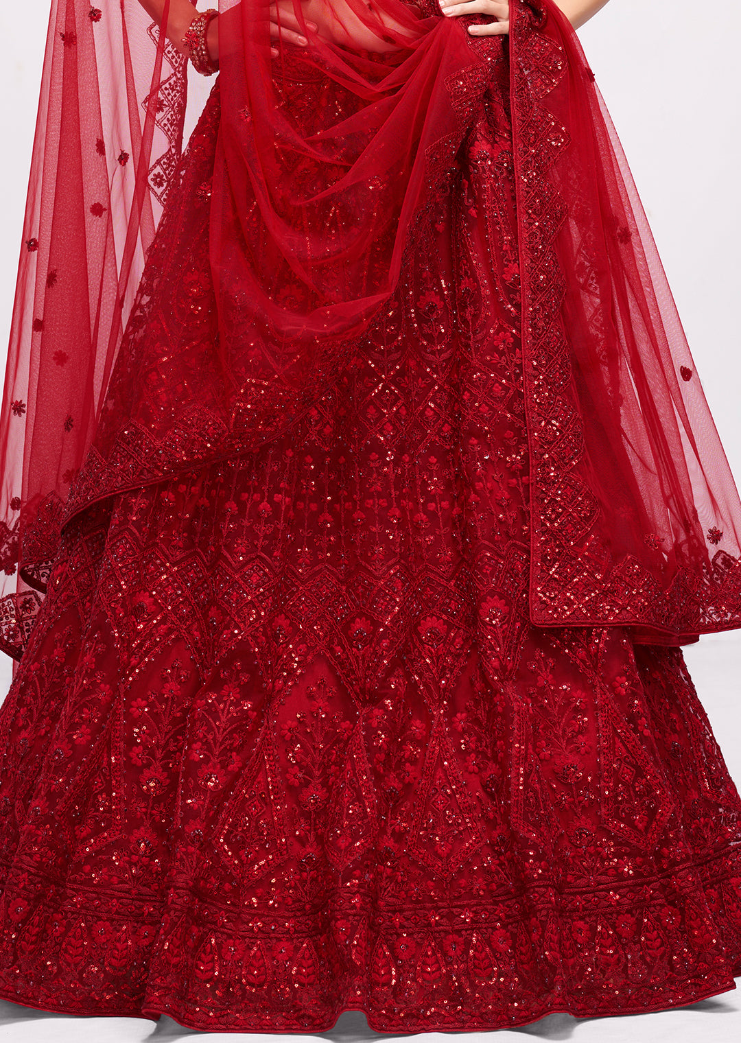 RED HEAVY EMBROIDERED PREMIUM NET DESIGNER LEHENGA