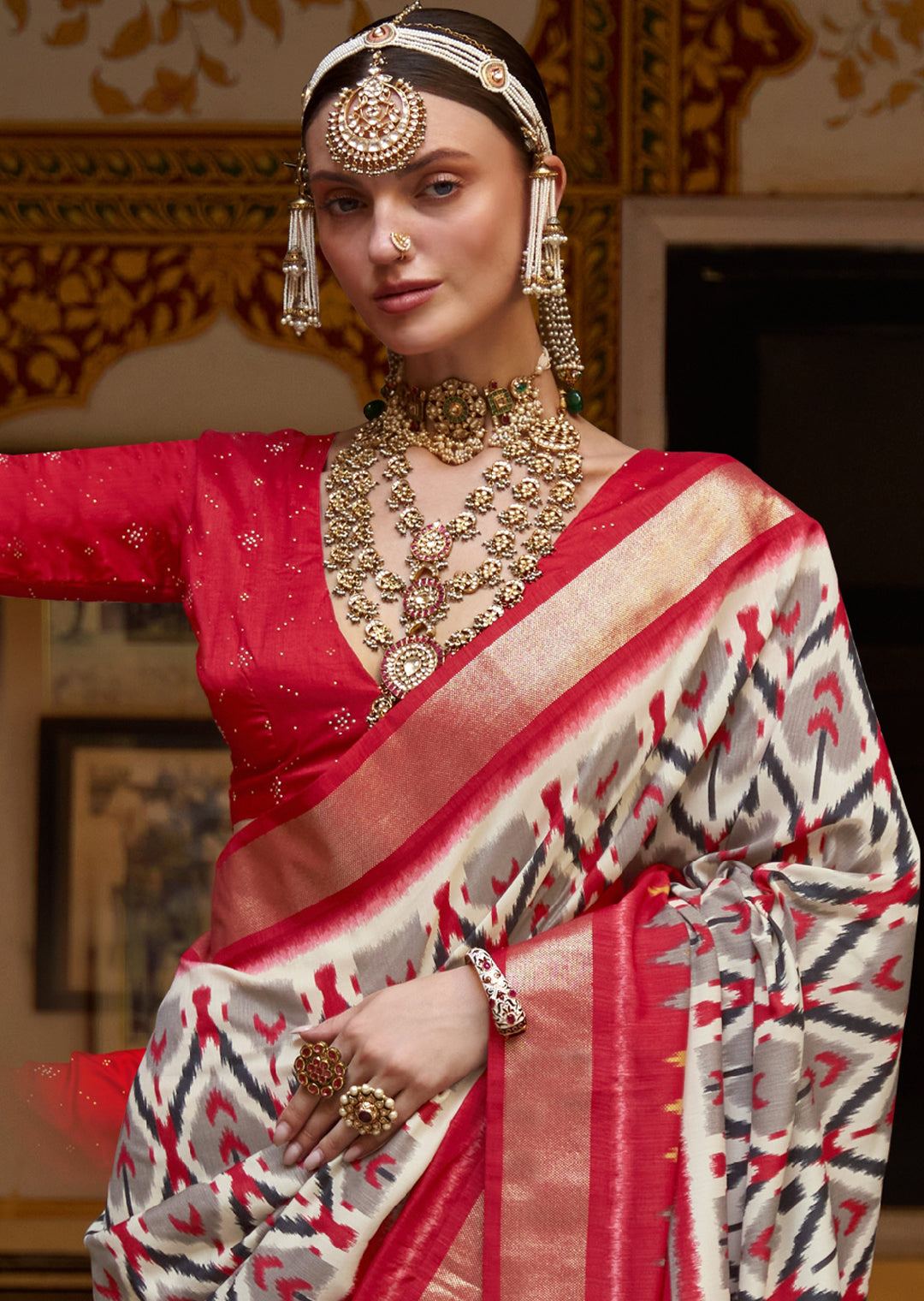 WHITE AND RED WOVEN PATOLA SILK SAREE