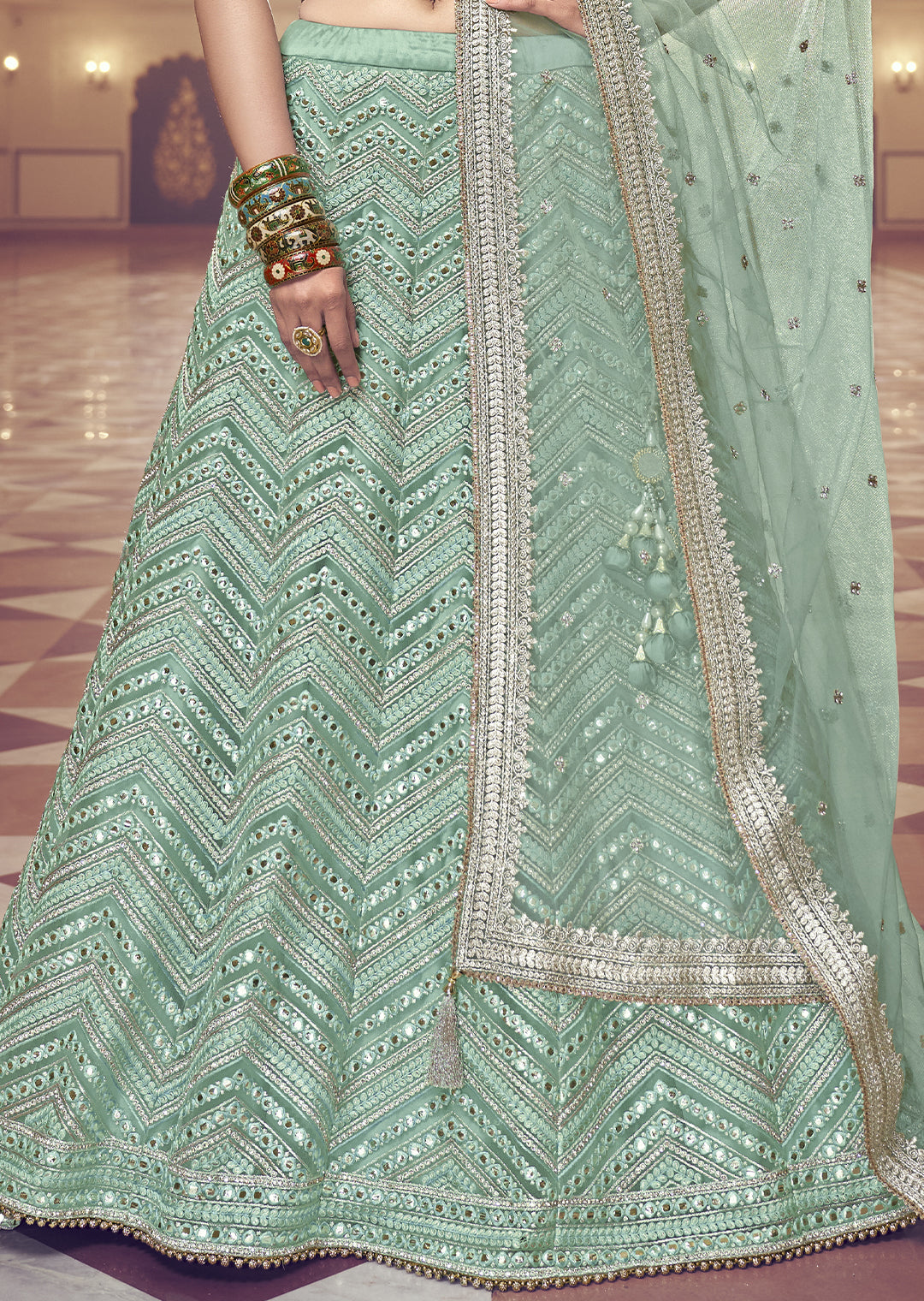 PALED TURQUOISE GREEN HEAVY EMBROIDERED PREMIUM NET DESIGNER LEHENGA