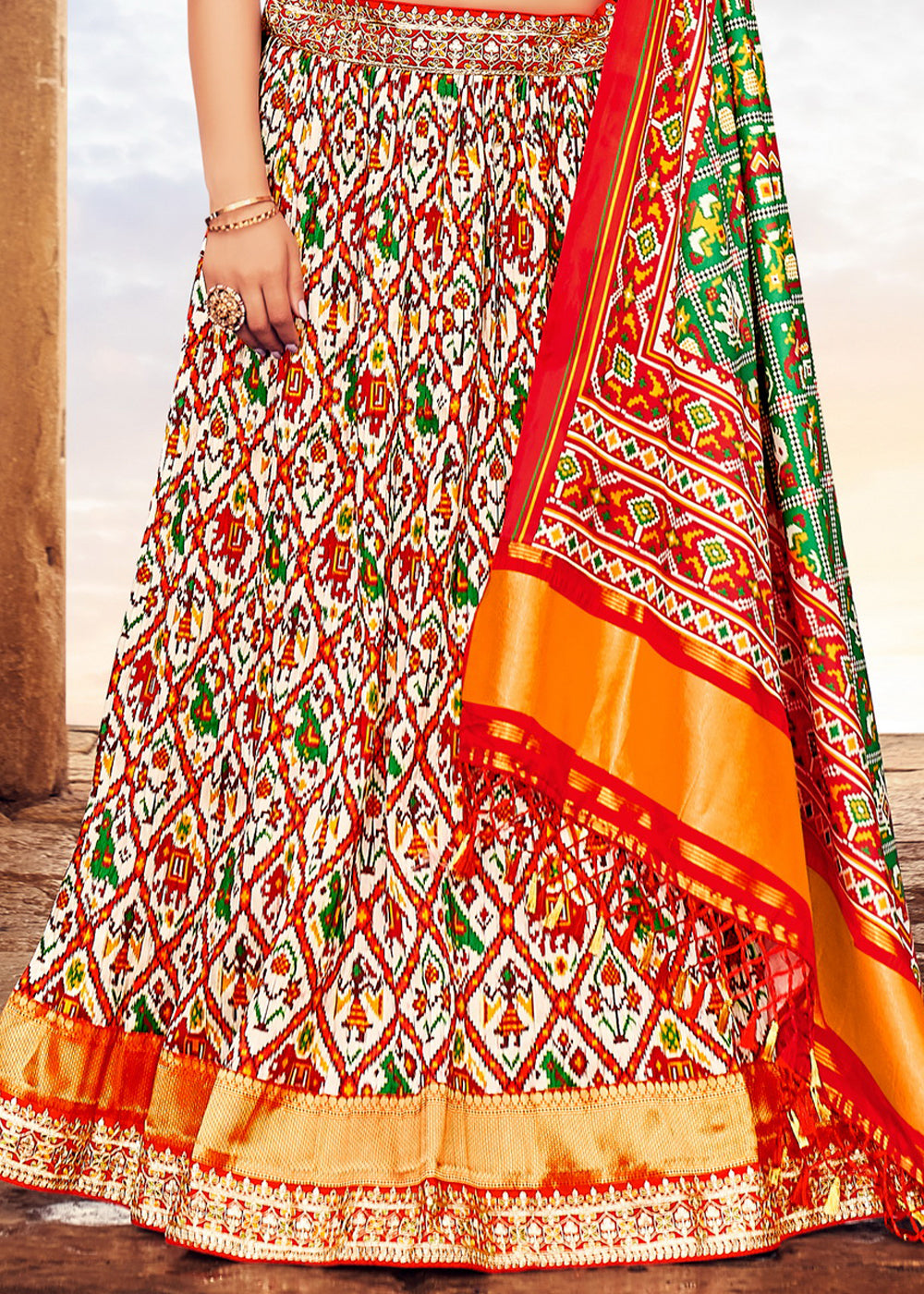 WHITE & RED	HAND CRAFTED PATOLA SILK LEHENGA WITH EMBROIDERED SILK BLOUSE