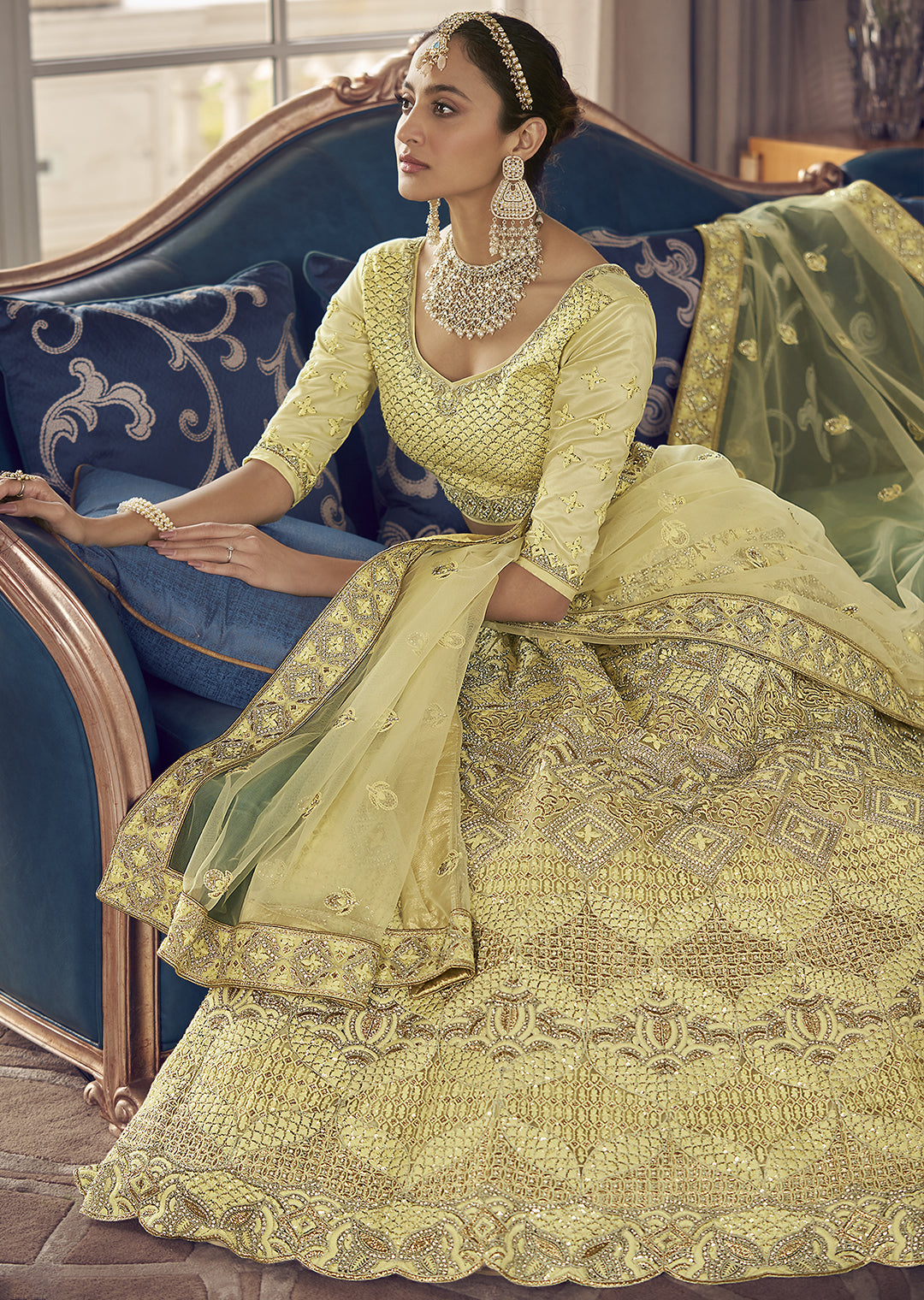 PARCHMENT YELLOW HEAVY EMBROIDERED DESIGNER LEHENGA